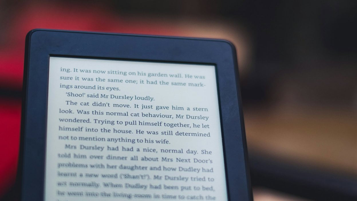Kindle e-reader displaying text outdoors