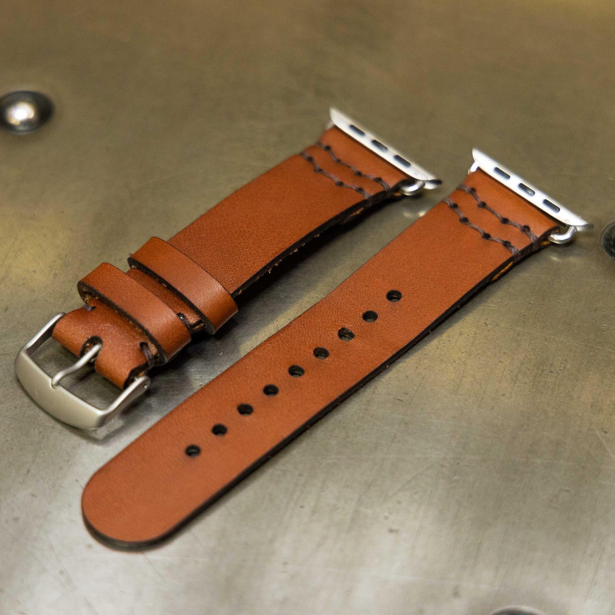 Two sizes of leather Apple Watch band with stainless hardware, made in Texas workshop