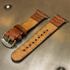 Leather Apple Watch band showing suede underside and hand-punched holes