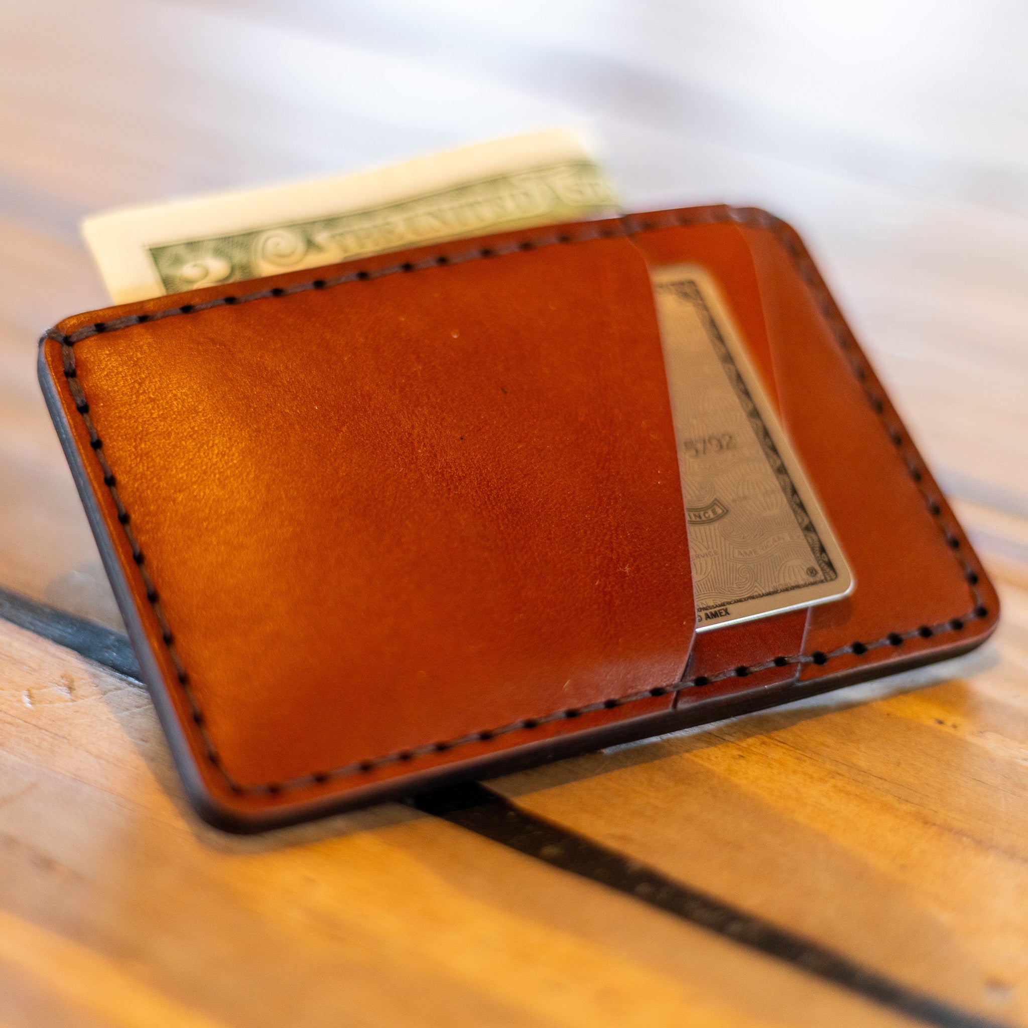 Front pocket wallet with card and cash in use, lifestyle shot