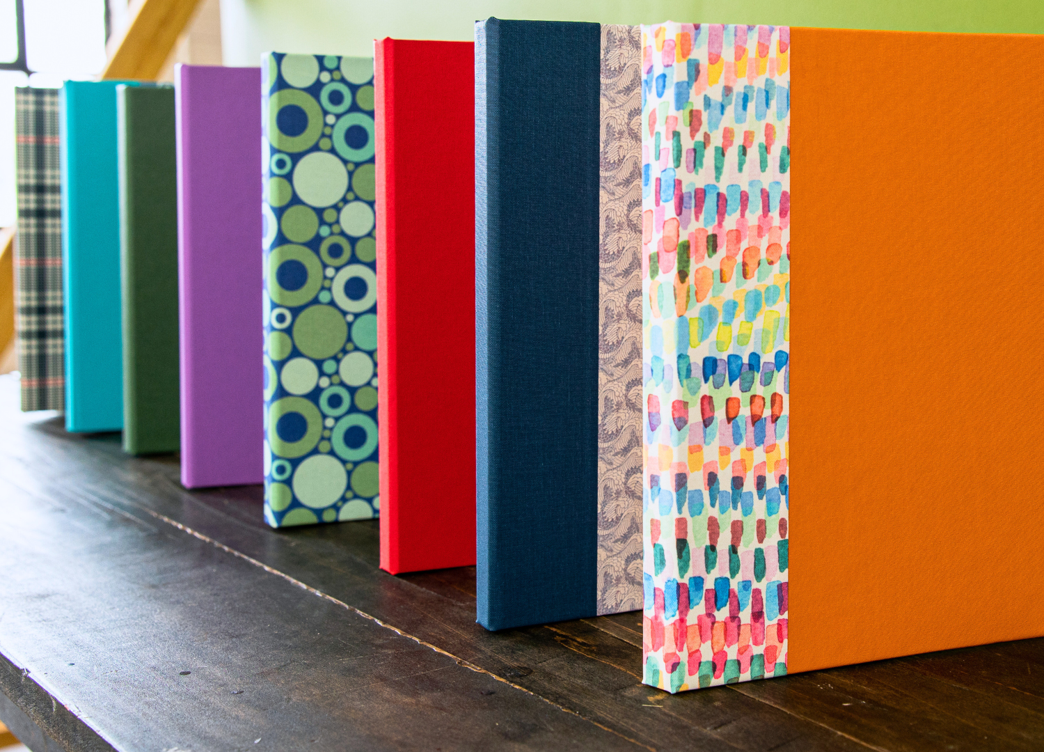 Custom iPad Cases group standing upright on a table with 8 different options 
