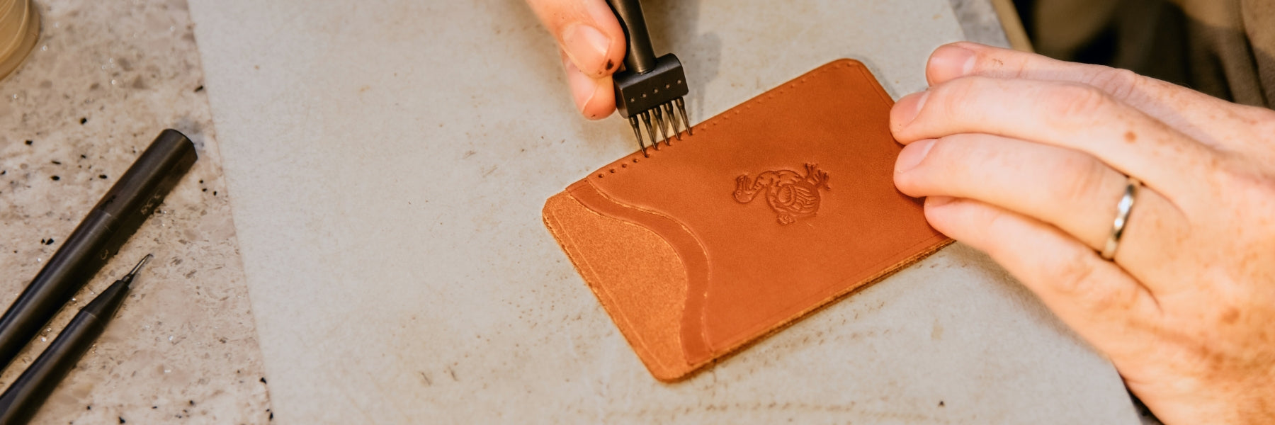 Leather Wallet being punched getting ready for hand sewing